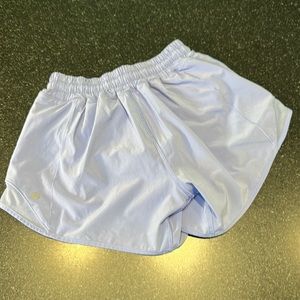 Lululemon purple Hotty Hot shorts with 4" inseam and side zip pocket.